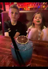 A family-focused vlog documenting a 10th birthday celebration at Buck's Bar. The video features the group enjoying a variety of dishes including chicken waffles, salt and chilli fries, and cocktails, highlighting the venue's suitability for both families and adults.