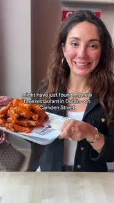 A creator visits Camden Rotisserie in Dublin, providing a personal review of the venue, menu, and several dishes including a spice bag, chicken burger, and chicken wings.