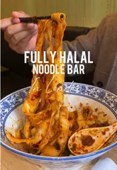 A short, engaging review of a Halal noodle bar in London, highlighting their hand-pulled noodles, lamb skewers, and beef rougamo.