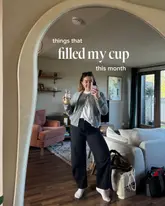 A personal lifestyle mirror selfie featuring a creator holding an iced coffee in a home setting. The post is part of a 'things that filled my cup' series, mentioning a coffee date at a local cafe.