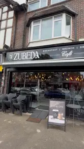 A montage showcasing the interior and food offerings at Zubeda Brunch & Desserts in Birmingham, highlighting dishes like the Nihari Sub and Butter Chicken Pie.