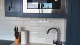 A promotional video showcasing a stay at Letham Feus Park, featuring drone footage of the holiday lodges, interior tours of the kitchen, bedroom, and living area with a log burner, and a family enjoying the private hot tub.