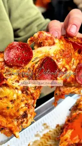 A review of Detroit-style pizza slabs at a venue in Newcastle, featuring close-ups of the food, cheese pulls, and a brief look at the venue's atmosphere.