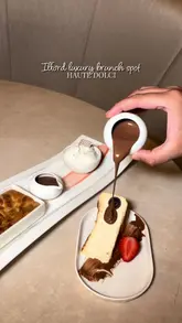 A promotional video for Haute Dolci in Ilford, highlighting their brunch and dessert menu, including pasta, cheesecake, and cookie dough, within a luxurious setting.