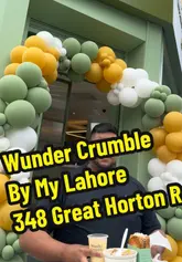 A creator reviews the food offerings at Wunder Crumble by MyLahore, showcasing loaded fries, a toastie, and a boba tea.