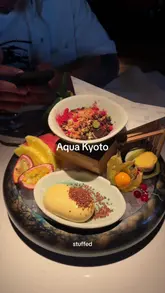A review of a sushi restaurant in London, showcasing a variety of dishes from a set menu, including sushi, bao buns, tempura, and desserts, while highlighting the dining experience.