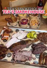 A fast-paced, engaging food review of Tea's Smokehouse, highlighting their smoked meats, platters, and sides. The video features close-up shots of brisket, ribs, and various sides, emphasizing the quality and preparation process.