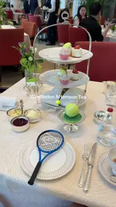 A video showcasing a Wimbledon-themed afternoon tea experience at The Peninsula Hotel in London, featuring the venue's elegant interior, the themed food presentation, and the overall atmosphere.