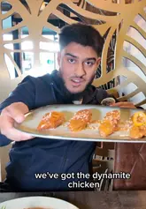 A creator provides an honest review of The Royal Palm on Ladypool Road, showcasing the venue's decor, service, and a variety of dishes including dynamite chicken, chicken parmesan, and ribeye steak.