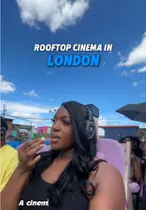A vlog-style review of the Rooftop Cinema Club in Stratford, London, highlighting the £17 ticket price which includes a lounge seat and popcorn. The video showcases the outdoor cinema experience, the skyline views, and the availability of casual food and drink options like fried chicken and slushies.