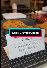 A short, visually appealing video showcasing the preparation of an apple crumble cookie served with soft serve ice cream, highlighting the texture and assembly process.
