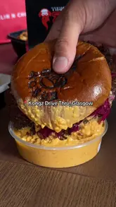 A review of Kongz Drive Thru in Glasgow, showcasing their burgers, loaded fries, and pizza. The video highlights the indulgent nature of the food and the convenience of the drive-thru service.