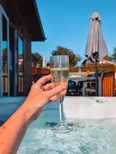 A family-focused vlog showcasing a stay at a holiday park in Hampshire, highlighting the lodge facilities, swimming pools, beach access, and nearby town of Lymington.