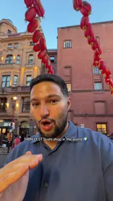 A creator visits 'Sushi Joy' in London's Chinatown, highlighting its status as the 'smallest sushi shop in the world'. The video features a quick tour of the tiny kiosk, a look at the chef preparing the food, and a taste test of various nigiri and rolls.