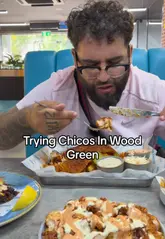 A first-person vlog review of a visit to Chicos in Wood Green, featuring a variety of dishes including a smash burger, loaded fries, wings, fish and chips, and a chocolate cake.