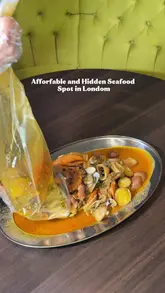 A review of Ambrosia restaurant in London, highlighting their newly launched seafood boil, as well as other menu items like burgers, pasta, and steaks. The video features the creator trying the food and provides a glimpse of the restaurant's interior and cocktail bar.