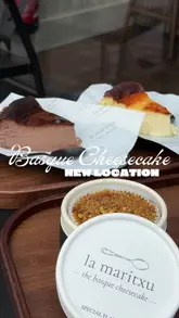 A short, aesthetic video highlighting the new location of a popular Basque cheesecake shop, featuring the original, chocolate, and pistachio flavours alongside iced coffee drinks.