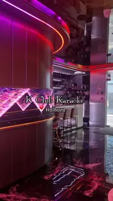 A group of friends visits K Club Karaoke in Holborn, showcasing the private karaoke rooms, mood lighting, cocktail menu, and bar snacks. The video highlights the fun atmosphere and suitability for group outings.