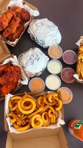 A creator visits the new Tuckkinn location at Hungr Hub in Sandyford, showcasing their signature tenders, the Truffle Jam Smash burger, and the Sweet TK Dip chicken burger, highlighting the unique sauces and overall quality of the food.