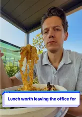 A creator provides a personal review of a Taiwanese noodle bar in London, specifically recommending the chicken with ginger and sesame noodles and suggesting the addition of chili oil.
