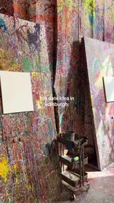 A short, energetic vlog showcasing a visit to Splatter Art Studios in Edinburgh. The video features a couple wearing protective gear, engaging in a messy, creative painting session, and displaying their finished abstract art, highlighting the venue as a fun, interactive date or group activity.