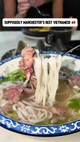 A vlog-style review of Pho Cue in Manchester, featuring a variety of dishes including Vietnamese tacos, salt and pepper chips, pho, and crispy chilli beef. The creator provides commentary on the food quality, the atmosphere, and the price, offering a comprehensive look at the dining experience.