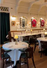 A montage of shots showcasing the interior and food offerings at Fitzgerald's, an Irish-American restaurant in London. The video features close-ups of steak, lamb, and desserts, alongside shots of the dining room.