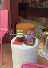 A group of friends visits a new retro-themed cafe in Covent Garden to test three visually striking signature drinks: an Australian Mont Blanc, a Mango Matcha, and an Ube Cold Cream. The video features quick cuts, on-camera reactions, and behind-the-scenes shots of the drink preparation.