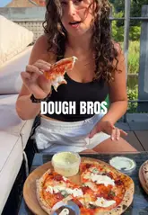 A creator reviews and demonstrates the assembly of an at-home pizza kit from The Dough Bros, showing the ingredients, preparation process, and final cooked result.