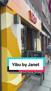 A review of Yibu by Janet in Dublin, showcasing the exterior, menu, and several dishes including a chicken rice bowl, Big Mac dumplings, and duck pancakes.