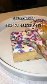 A fast-paced review comparing various 'school cake' and birthday cake-flavored desserts from multiple UK supermarkets and one independent dessert shop, ranking them based on taste and texture.