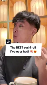 A review-style video where a creator visits Akatuki in London, showcasing the interior and various Japanese dishes including sushi rolls, sashimi, and takoyaki.