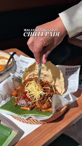 A montage of various Malaysian dishes served at Chilli Padi in Stratford, featuring close-ups of laksa, mee goreng, satay, and other menu items, interspersed with brief shots of the restaurant interior.