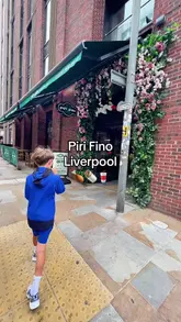 A mother and her two children visit Piri Fino in Liverpool for lunch, showcasing the venue's interior, their meal of chicken wraps and wings, and the use of the EatClub app to get a discount on their bill.