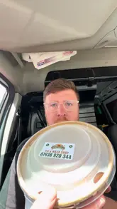 A creator reviews a traditional pie and mash takeaway meal from a shop in Newcastle while sitting in his van. He provides a direct, honest assessment of the food, focusing on the quality of the pie, mash, and gravy.