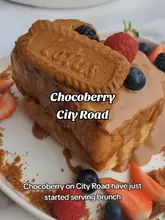 A short video review of Chocoberry in Cardiff, showcasing their new brunch menu. The video features close-ups of their Lotus Biscoff French toast, a South Asian breakfast platter, and a milkshake, alongside shots of the venue's floral interior and a quick look at the menu.