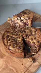 A step-by-step recipe tutorial for a Nutella-stuffed cookie pie, showing the mixing of ingredients, assembly, and the final gooey result.