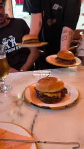 A promotional montage for 'Sure Thing' in Acton, West London, highlighting their burgers, wine list, and cozy, vibey atmosphere.