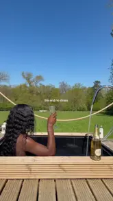 A short, aesthetic montage showcasing a cabin getaway, featuring shots of the exterior, a cozy interior, a hot tub, a BBQ, and the surrounding countryside.