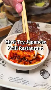 A video review of Inko Nito, a Japanese charcoal grill restaurant in Soho, showcasing their £28 six-course tasting menu and various dishes like pork ribs, salmon, and tempura sushi.