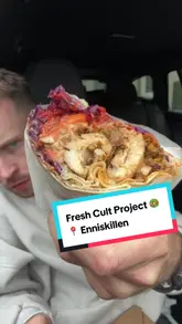 A first-person vlog review of a cafe called Fresh Cult Project in Enniskillen, featuring an iced coffee, a flatbread, and a Mexican sandwich.