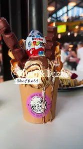A short, visually focused reel showcasing two indulgent desserts—a Kinderella bubble waffle and pistachio French toast—at Drip & Drizzle, located within the Cambridge Street Collective food hall in Sheffield.