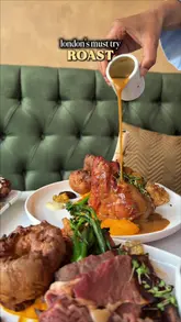 A visually appealing and well-shot showcase of a Sunday roast and various small plates at Meli-Melo in London, highlighting the food presentation and restaurant interior.