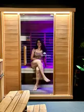 A vlog-style video showcasing a private wellness suite experience in Glasgow, featuring an infrared sauna and ice baths. The creators demonstrate the private room setup, the ease of use, and the relaxing nature of the contrast therapy session.