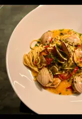 A high-quality, music-led montage showcasing the interior, drinks, and a variety of dishes at Lennox restaurant in Edinburgh, highlighting the restaurant's elegant ambiance and creative menu.