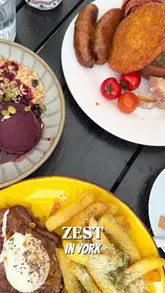 A couple visits Zest in York to review their new menu, showcasing the outdoor terrace, various brunch and lunch dishes, and their cocktail offerings.