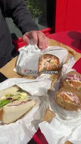 A short, punchy review of Piece in Glasgow, showcasing their large, freshly made sandwiches including the Chicken Ole, Cubano, and Reuben. The video features quick cuts of the food, the menu board, and the shop exterior.