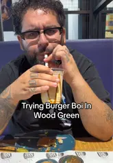 A food review vlog featuring a visit to Burger Boi in Wood Green, where the creator samples various items including smash burgers, chicken tenders, and a milkshake.