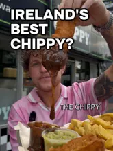 A high-energy, engaging review of The Chippy in Shankill, featuring the creator sampling various menu items including fish and chips, southern fried chicken, and a chippy burger.