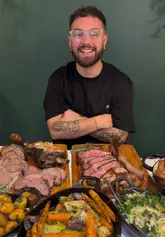 A vibrant, fast-paced vlog showcasing a family-style Sunday roast experience at Fennell. The video features the creator and guests enjoying a variety of sharing starters, large cuts of meat carved at the table, communal sides, and indulgent sharing desserts, emphasizing the generous, celebratory atmosphere of the meal.